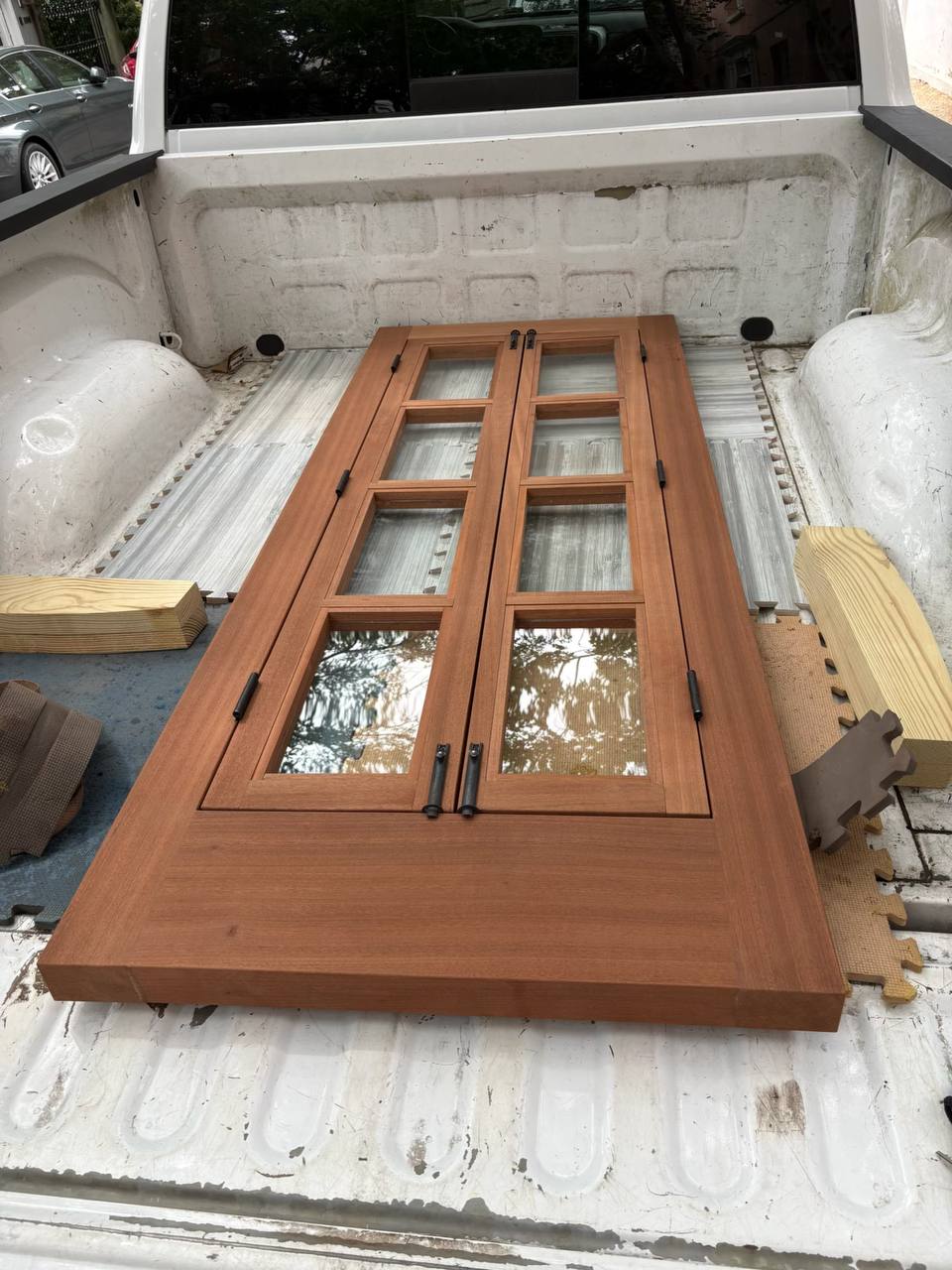 A finished pair of Sapele French doors with divided lites