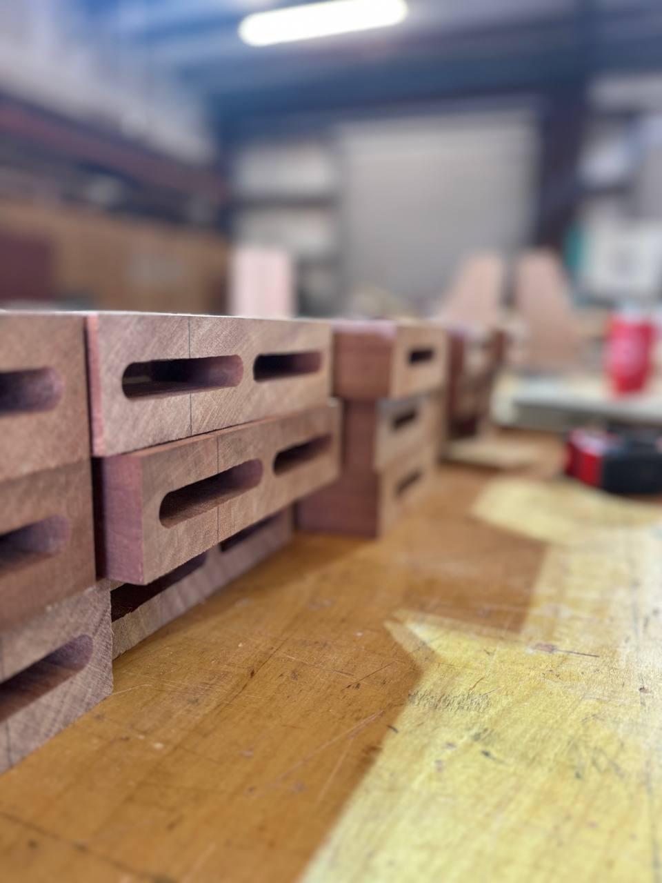 Stacks of finished Sapele brackets with pockets routed in