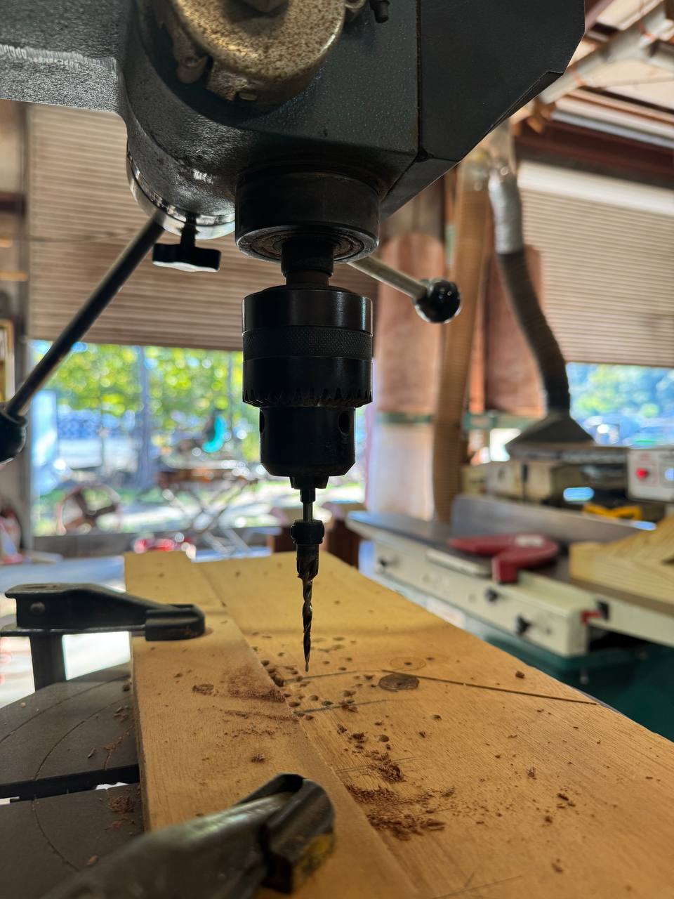 Drilling at the drill press, shavings flying
